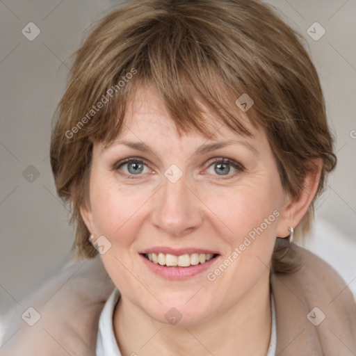 Joyful white adult female with medium  brown hair and grey eyes