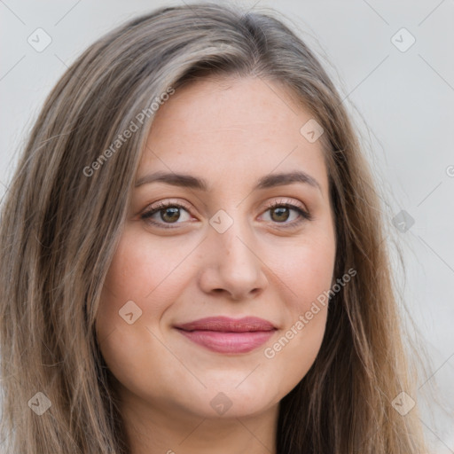 Joyful white young-adult female with long  brown hair and grey eyes