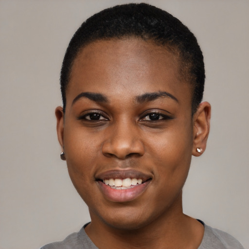 Joyful black young-adult female with short  black hair and brown eyes