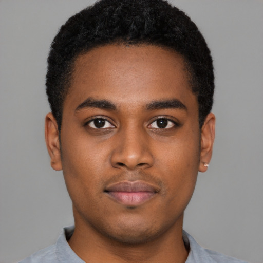 Neutral black young-adult male with short  black hair and brown eyes