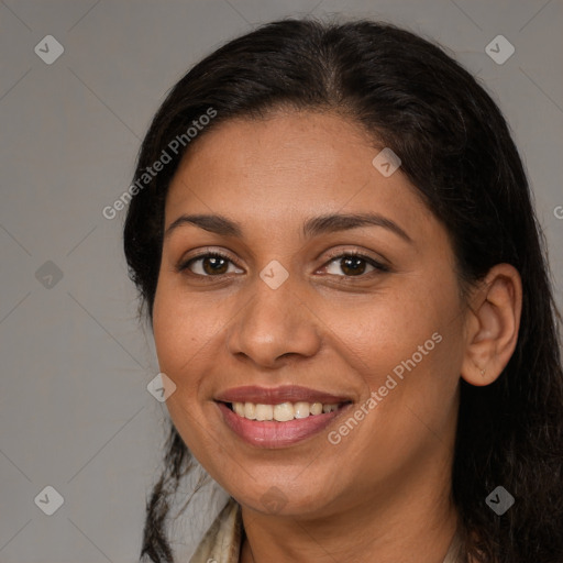 Joyful white adult female with long  brown hair and brown eyes