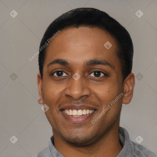 Joyful latino young-adult male with short  black hair and brown eyes