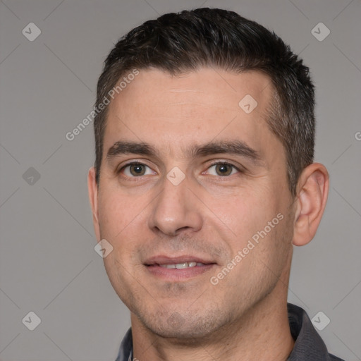 Joyful white adult male with short  brown hair and brown eyes