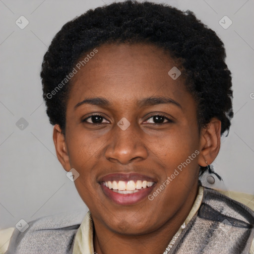 Joyful black young-adult female with short  black hair and brown eyes