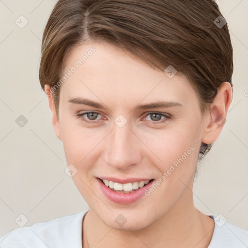 Joyful white young-adult female with short  brown hair and brown eyes