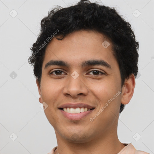 Joyful latino young-adult male with short  brown hair and brown eyes