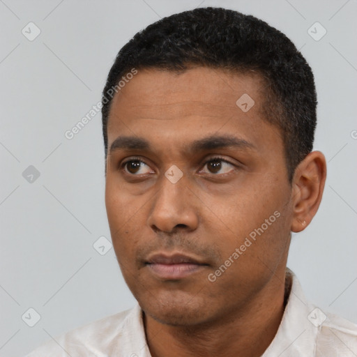 Neutral latino young-adult male with short  black hair and brown eyes