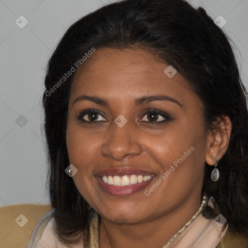 Joyful black young-adult female with long  brown hair and brown eyes