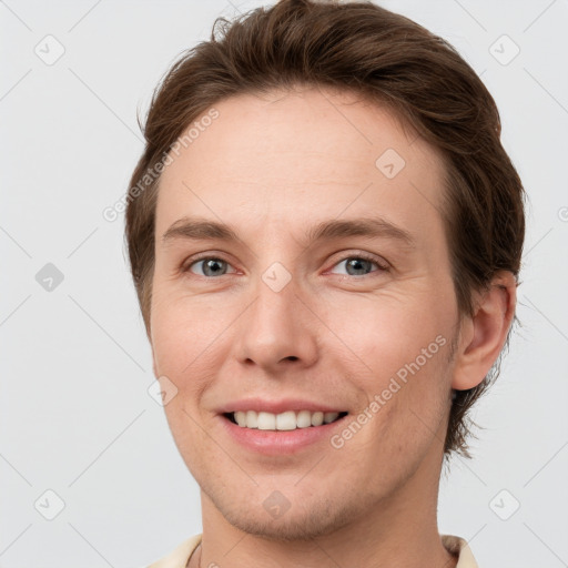 Joyful white young-adult female with short  brown hair and grey eyes