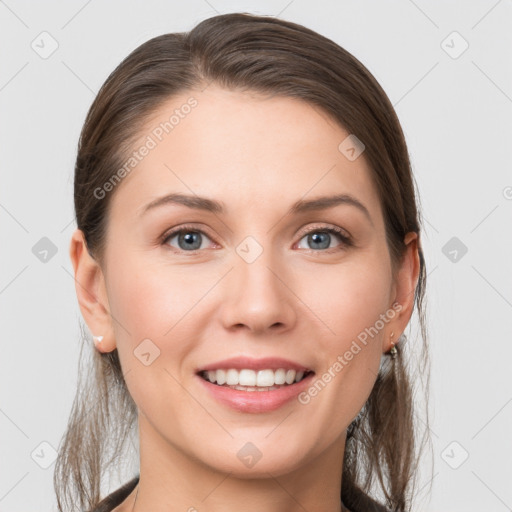 Joyful white young-adult female with long  brown hair and grey eyes