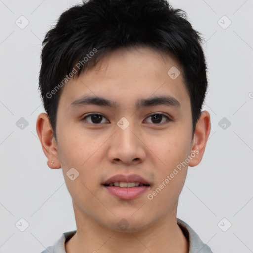 Joyful asian young-adult male with short  brown hair and brown eyes