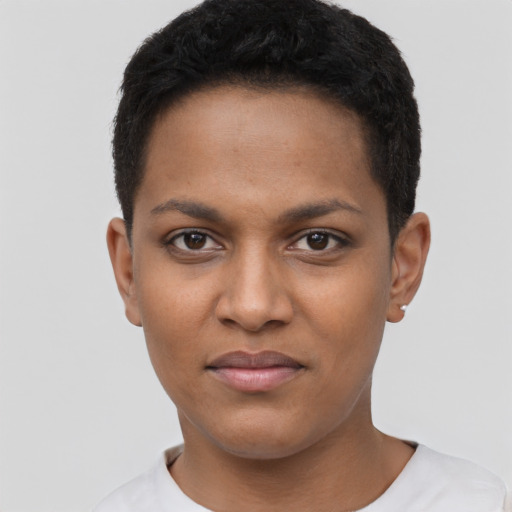 Joyful black young-adult female with short  black hair and brown eyes