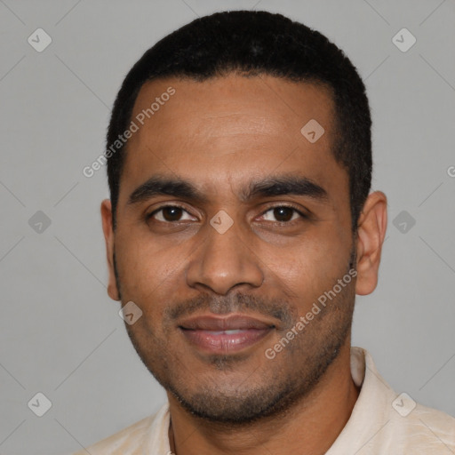 Joyful black young-adult male with short  black hair and brown eyes