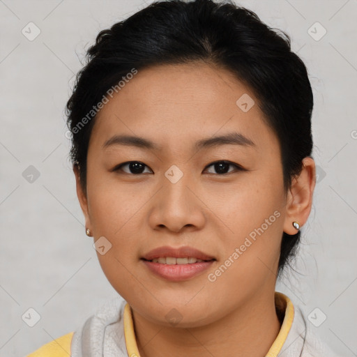 Joyful asian young-adult female with short  brown hair and brown eyes