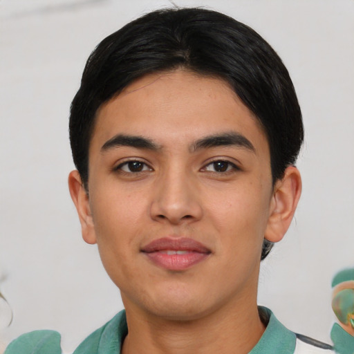 Joyful asian young-adult male with short  black hair and brown eyes