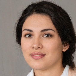 Joyful white young-adult female with medium  brown hair and brown eyes