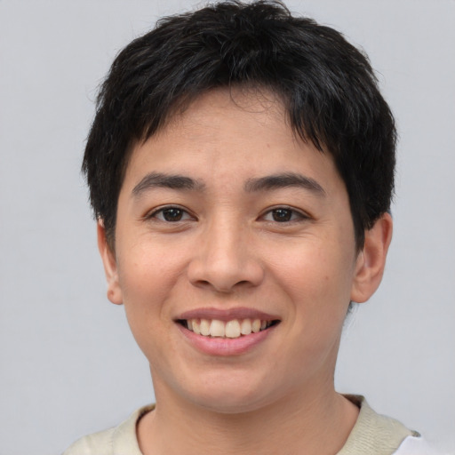 Joyful asian young-adult male with short  brown hair and brown eyes