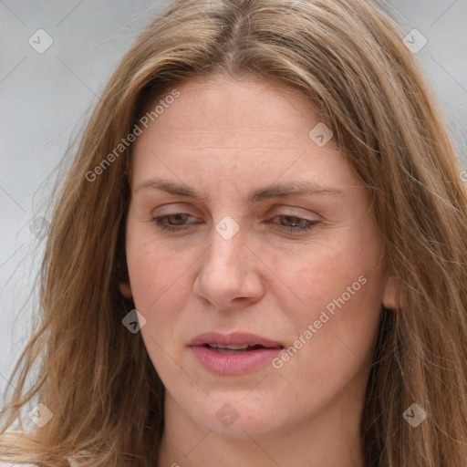 Joyful white adult female with long  brown hair and brown eyes