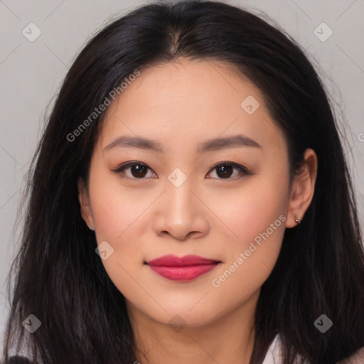 Joyful asian young-adult female with long  brown hair and brown eyes