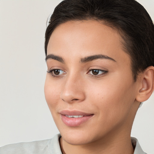 Joyful white young-adult female with short  brown hair and brown eyes