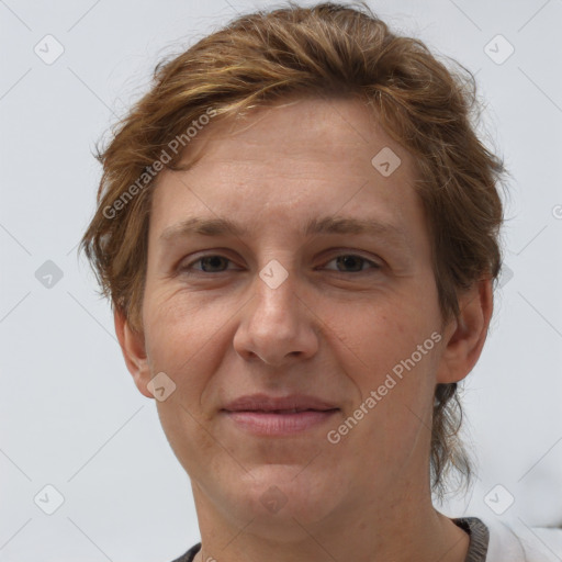 Joyful white adult female with short  brown hair and grey eyes