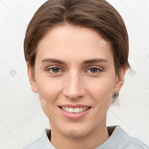 Joyful white young-adult female with short  brown hair and grey eyes