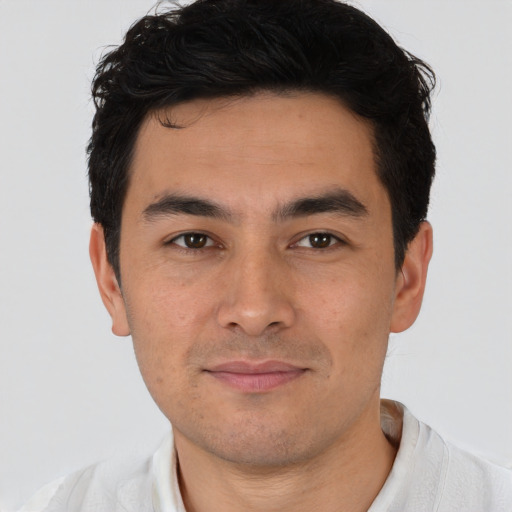 Joyful asian young-adult male with short  black hair and brown eyes