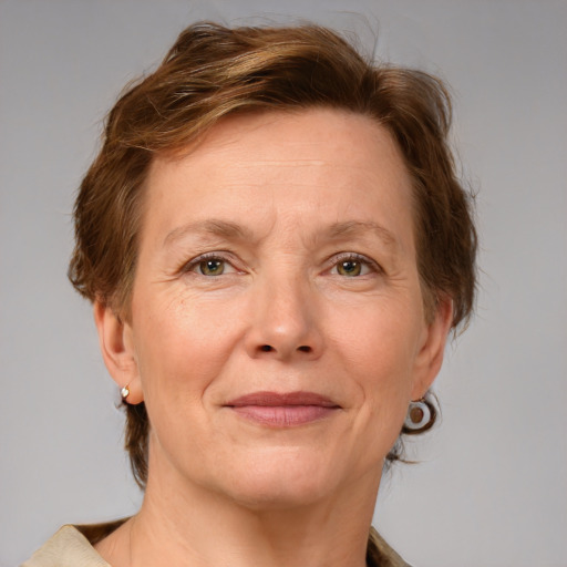 Joyful white adult female with medium  brown hair and grey eyes