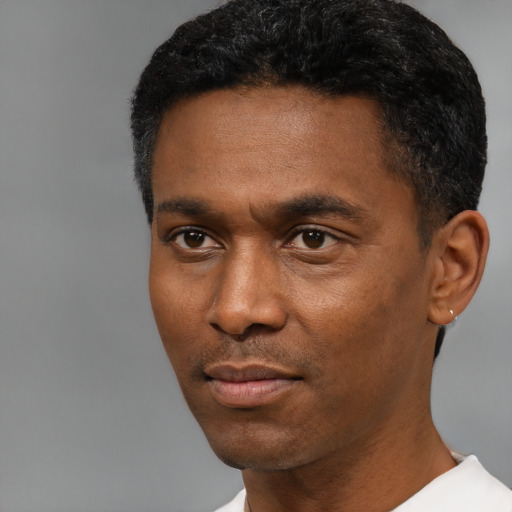 Neutral black young-adult male with short  black hair and brown eyes