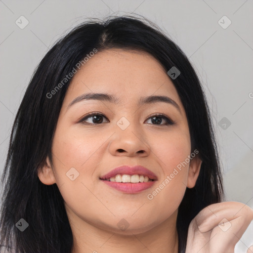 Joyful asian young-adult female with long  brown hair and brown eyes