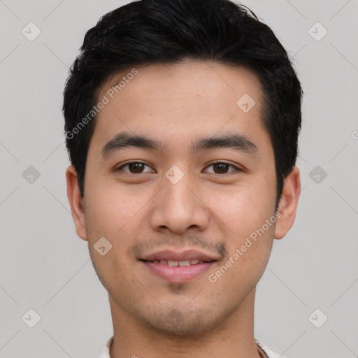 Joyful asian young-adult male with short  black hair and brown eyes