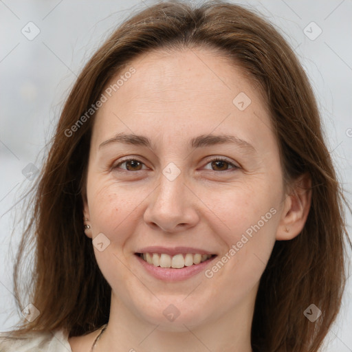 Joyful white adult female with long  brown hair and brown eyes