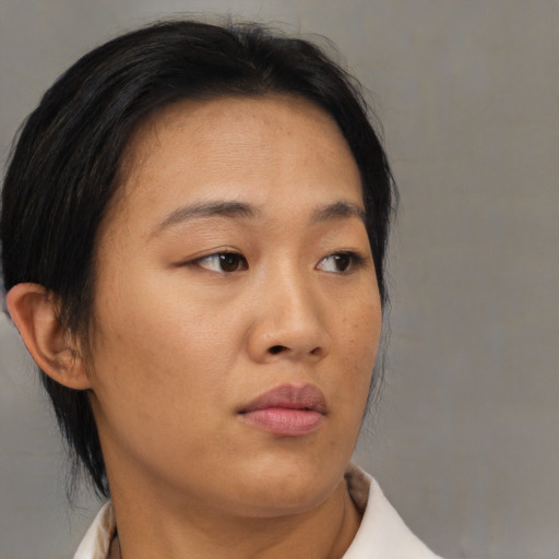 Neutral asian young-adult female with medium  brown hair and brown eyes