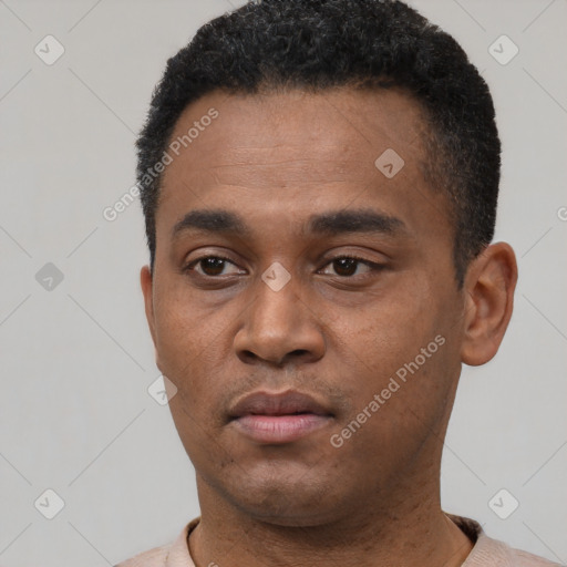 Neutral latino young-adult male with short  black hair and brown eyes