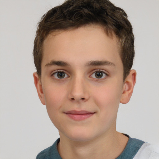 Joyful white child male with short  brown hair and brown eyes