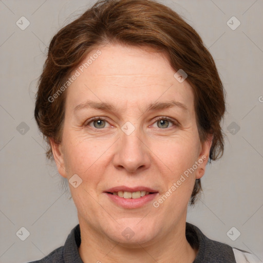 Joyful white adult female with medium  brown hair and grey eyes