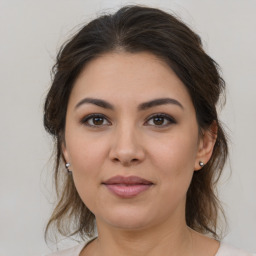 Joyful white young-adult female with medium  brown hair and brown eyes