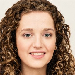 Joyful white young-adult female with long  brown hair and green eyes