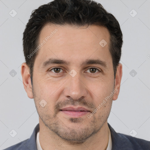 Joyful white adult male with short  brown hair and brown eyes