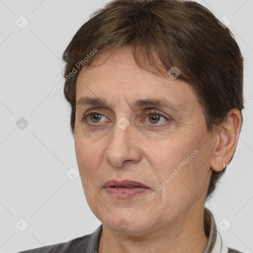 Joyful white adult female with short  brown hair and brown eyes