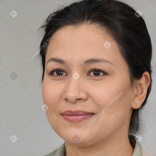 Joyful white adult female with medium  brown hair and brown eyes