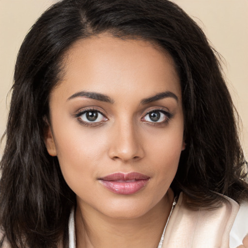 Joyful white young-adult female with long  brown hair and brown eyes