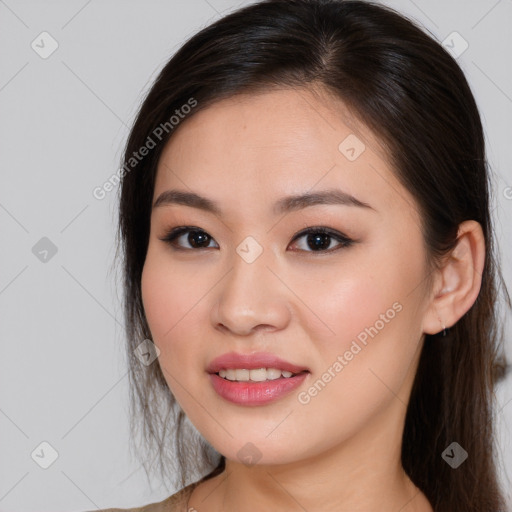 Joyful asian young-adult female with long  brown hair and brown eyes