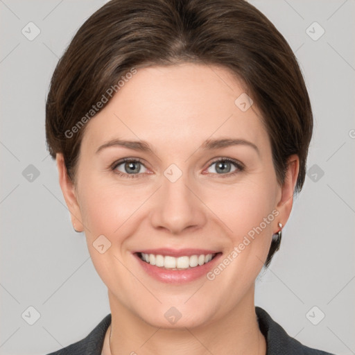 Joyful white young-adult female with medium  brown hair and grey eyes