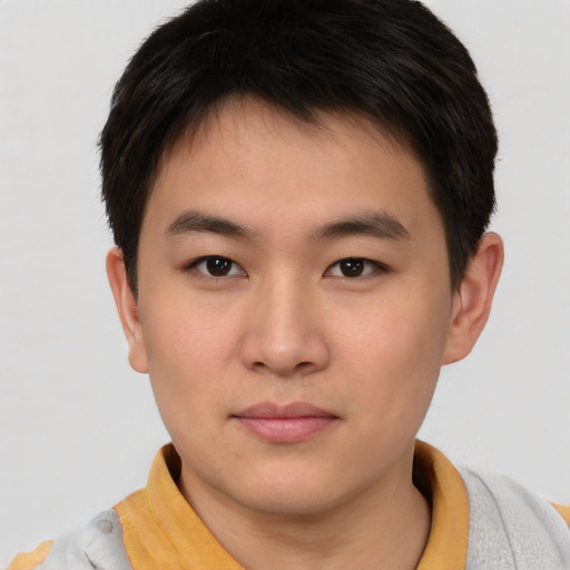 Neutral asian young-adult male with short  brown hair and brown eyes
