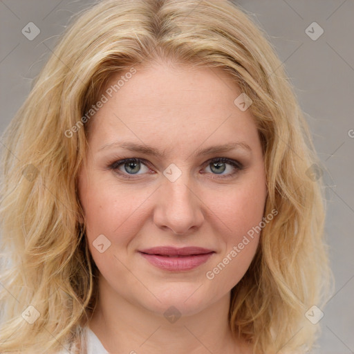 Joyful white young-adult female with medium  brown hair and blue eyes