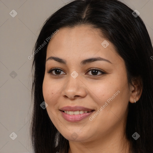 Joyful latino young-adult female with long  brown hair and brown eyes