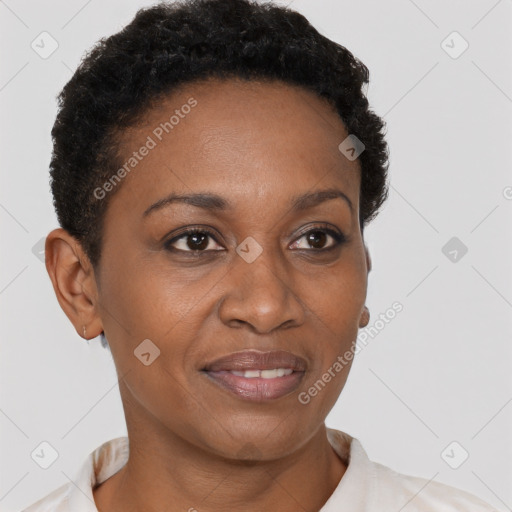 Joyful black adult female with short  brown hair and brown eyes