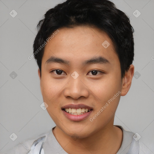 Joyful asian young-adult male with short  black hair and brown eyes