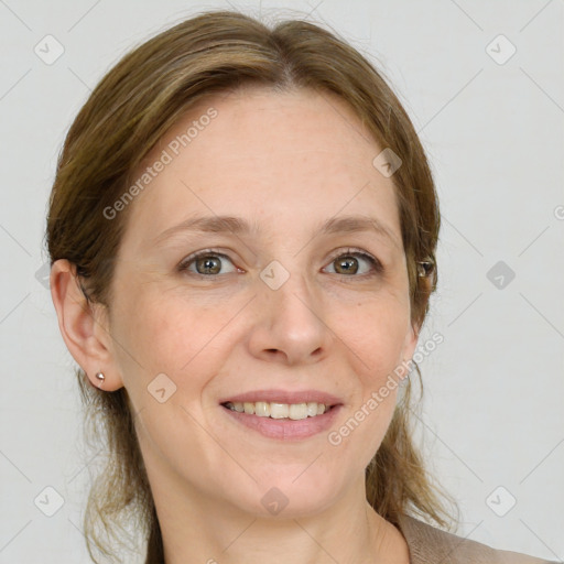 Joyful white adult female with medium  brown hair and grey eyes